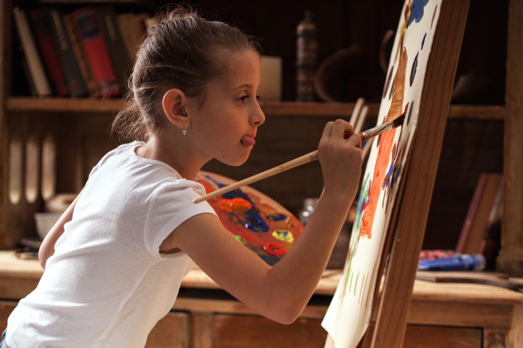 Young talented girl artist painter